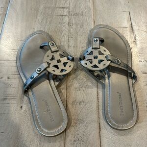 Gray/silver flip flops